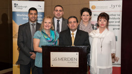 Group of International team representatives standing at a lectern in a conference room in Egypt. 